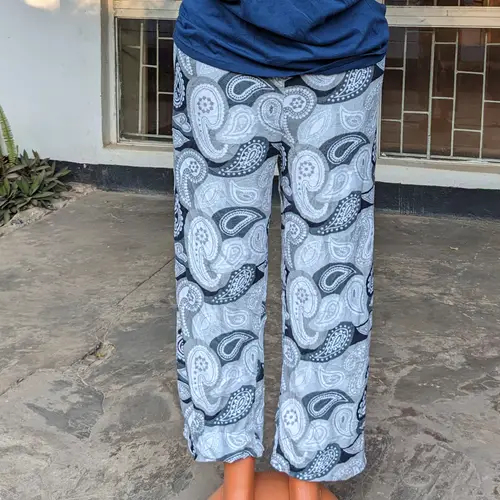 A mannequin displaying blue and white patterned lounge pants paired with a blue t-shirt.